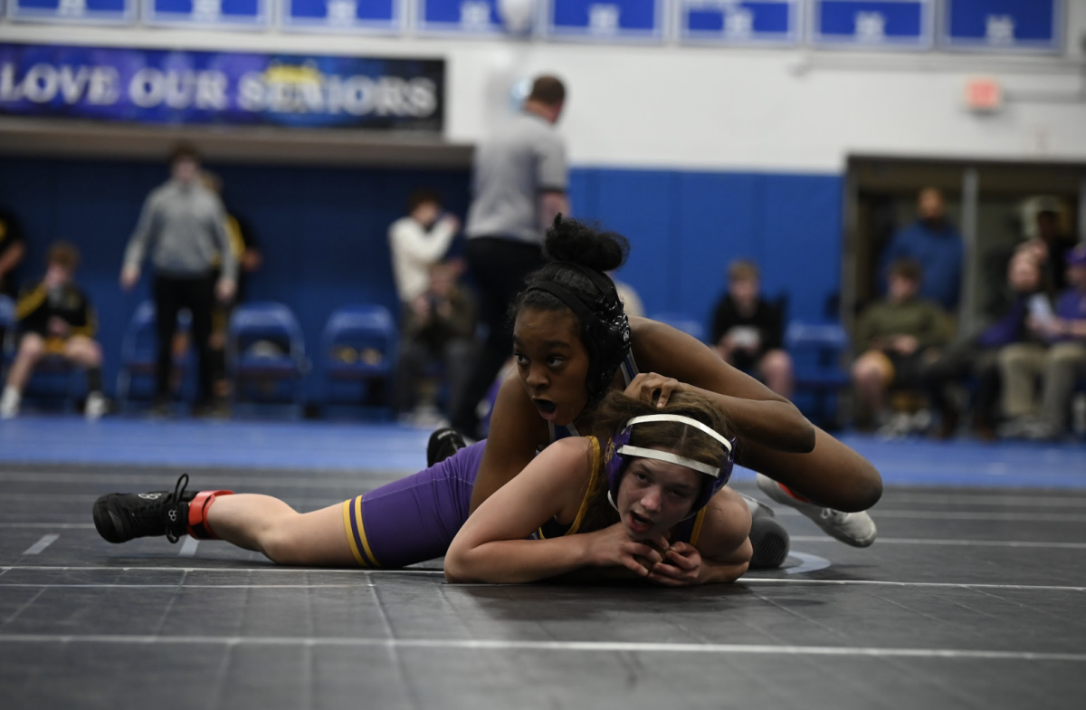 Lauren Battle (10) looks over to her coach for advice as a first year she states. "I feel like it really changed my life in a way and it's a combative sport that can be used day to day," said Battle. 